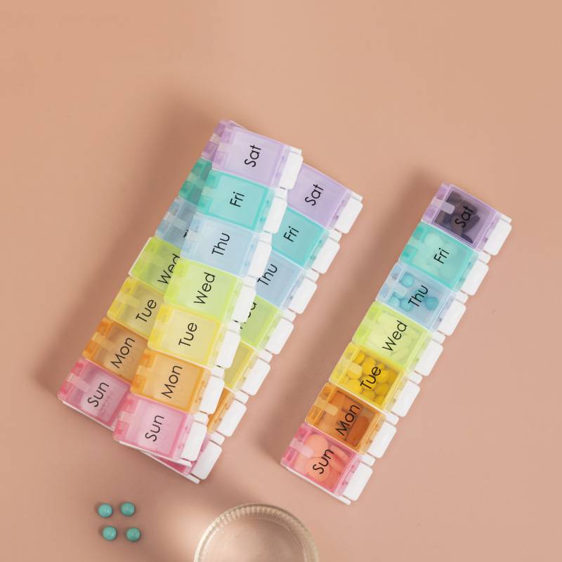 Tragbare tragbare 7-Grid Rainbow Bounce Button Pillendose