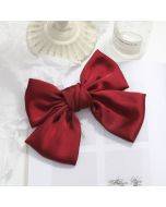 5 satin bow hair clips for sale, with hair accessories on the back of the head
